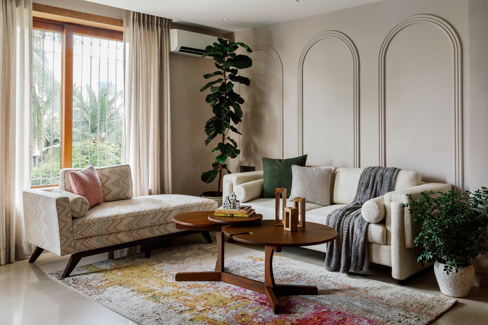Sandy-hued walls and beige marble (from Classic Marble Company) with clean-lined furniture. Soft furnishings include chevron-patterned upholstery (from The Pure Concept) for the day-bed, sheer curtains (from D’Deco
